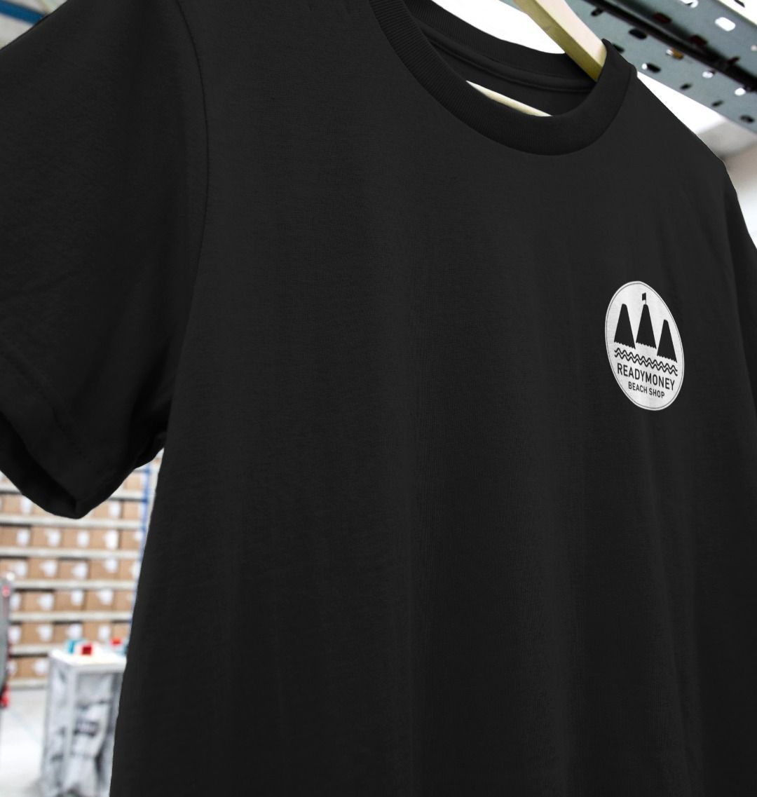 women’s black staff t-shirt close up, Readymoney Beach Shop logo, soft cotton work uniform tee