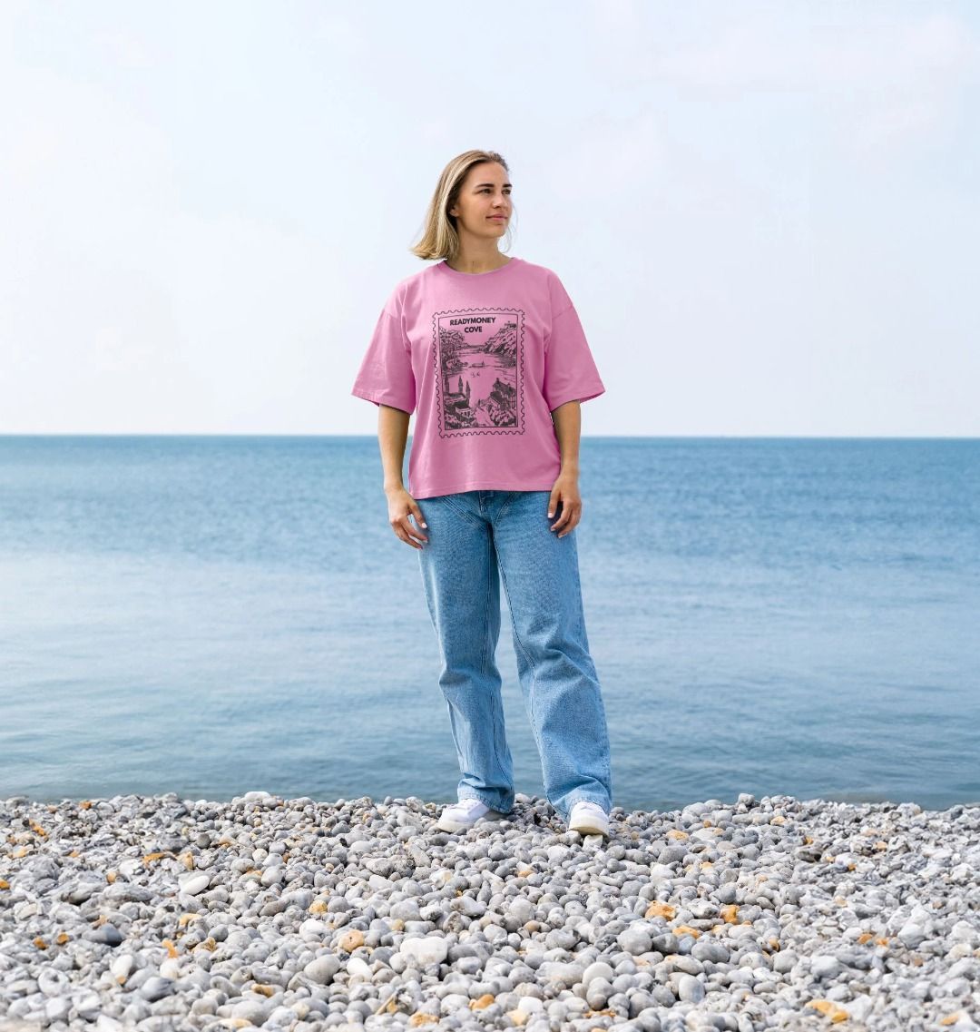 rose pink oversized women’s tee with Readymoney Cove stamp—soft cotton, vintage coastal print, ideal for relaxed travel looks