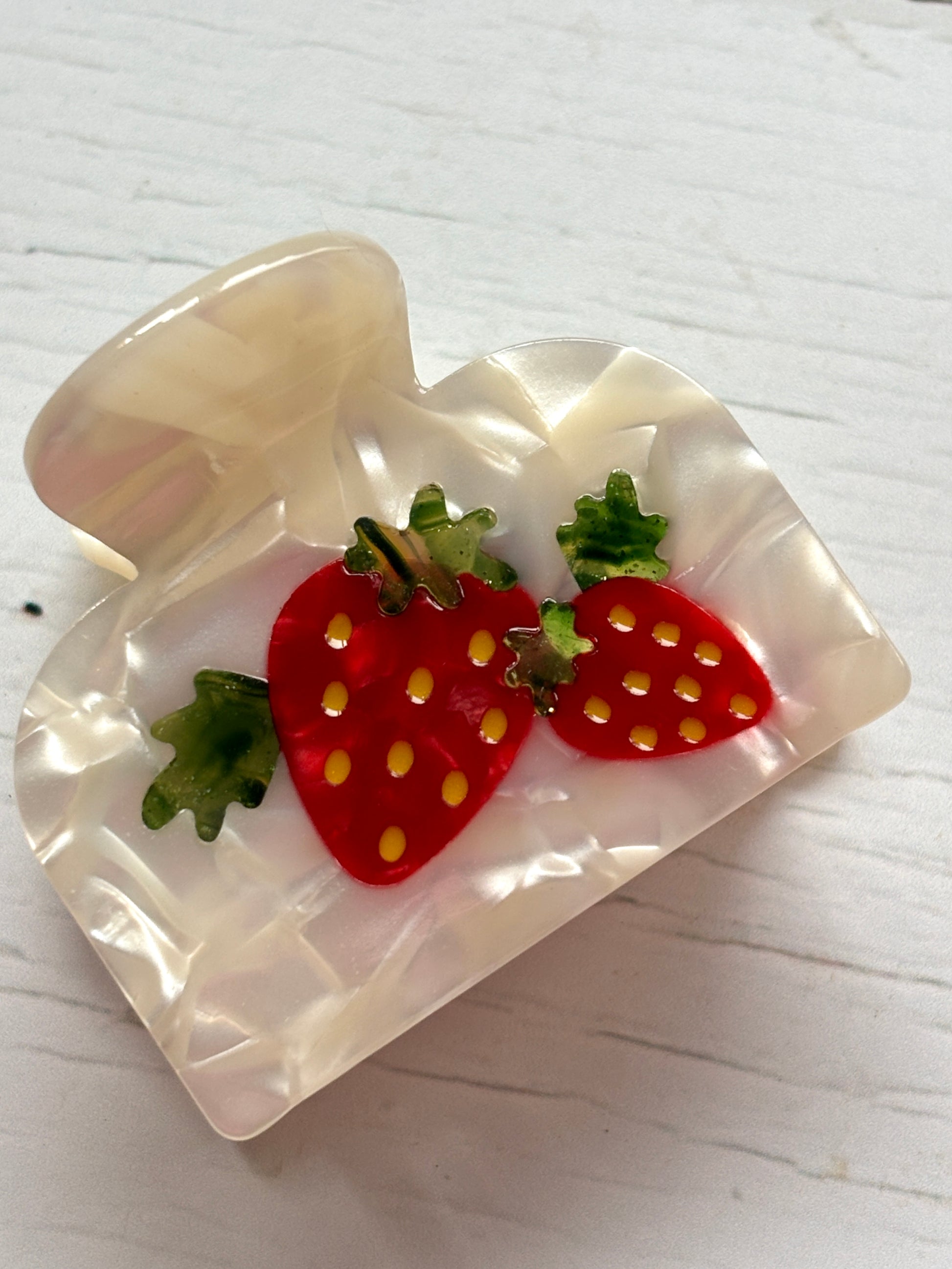 strawberries & cream hair claw—pearlescent clip with red berry accents, textured finish, and secure grip for sweet styling