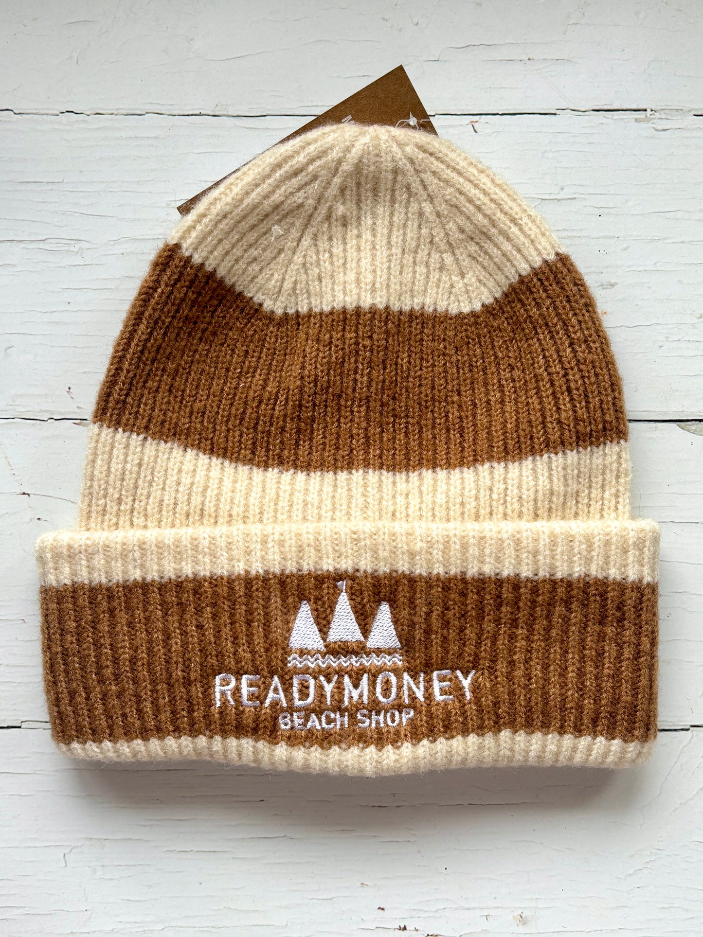 warm vanilla-coffee striped knit beanie with embroidered beach shop logo—perfect cozy accessory for winter and coastal style