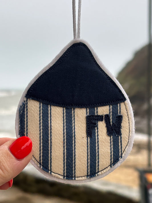 striped buoy-shaped fabric hanging with embroidered “FW”—handcrafted nautical accent for coastal-inspired decor