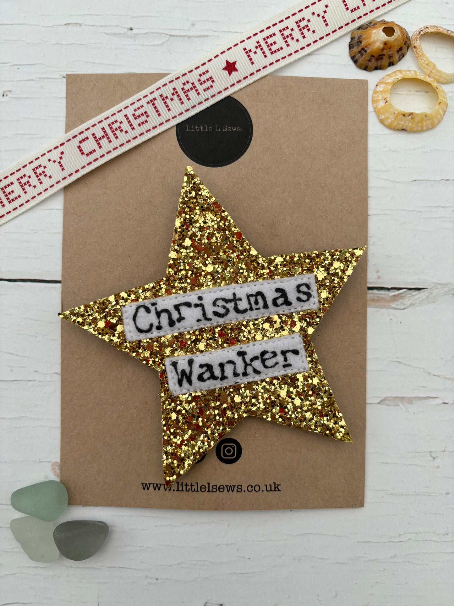 gold glitter badge with the word christmas wanker 