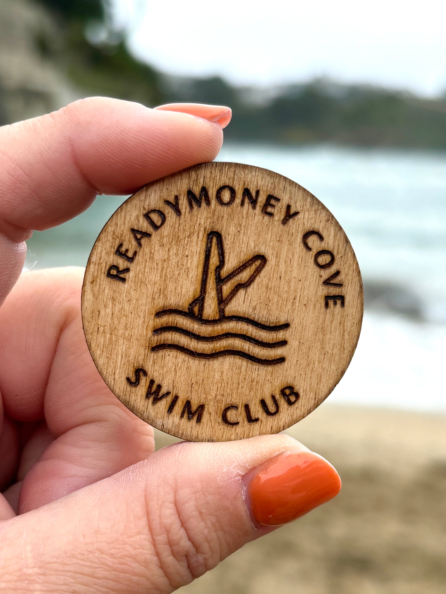 wooden 'Readymoney Cove Swim Club' circular badge/brooch pin laser-etched beach scene illustration, coastal souvenir, nautical accessory