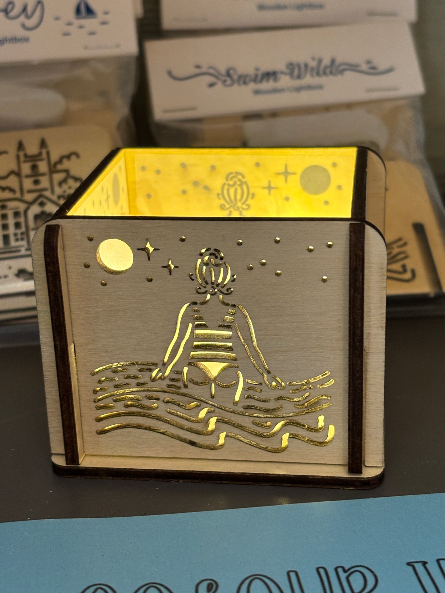 swim wild wooden lightbox—striped swimmer and moonlit sea design for cozy coastal decor and wild swim lovers