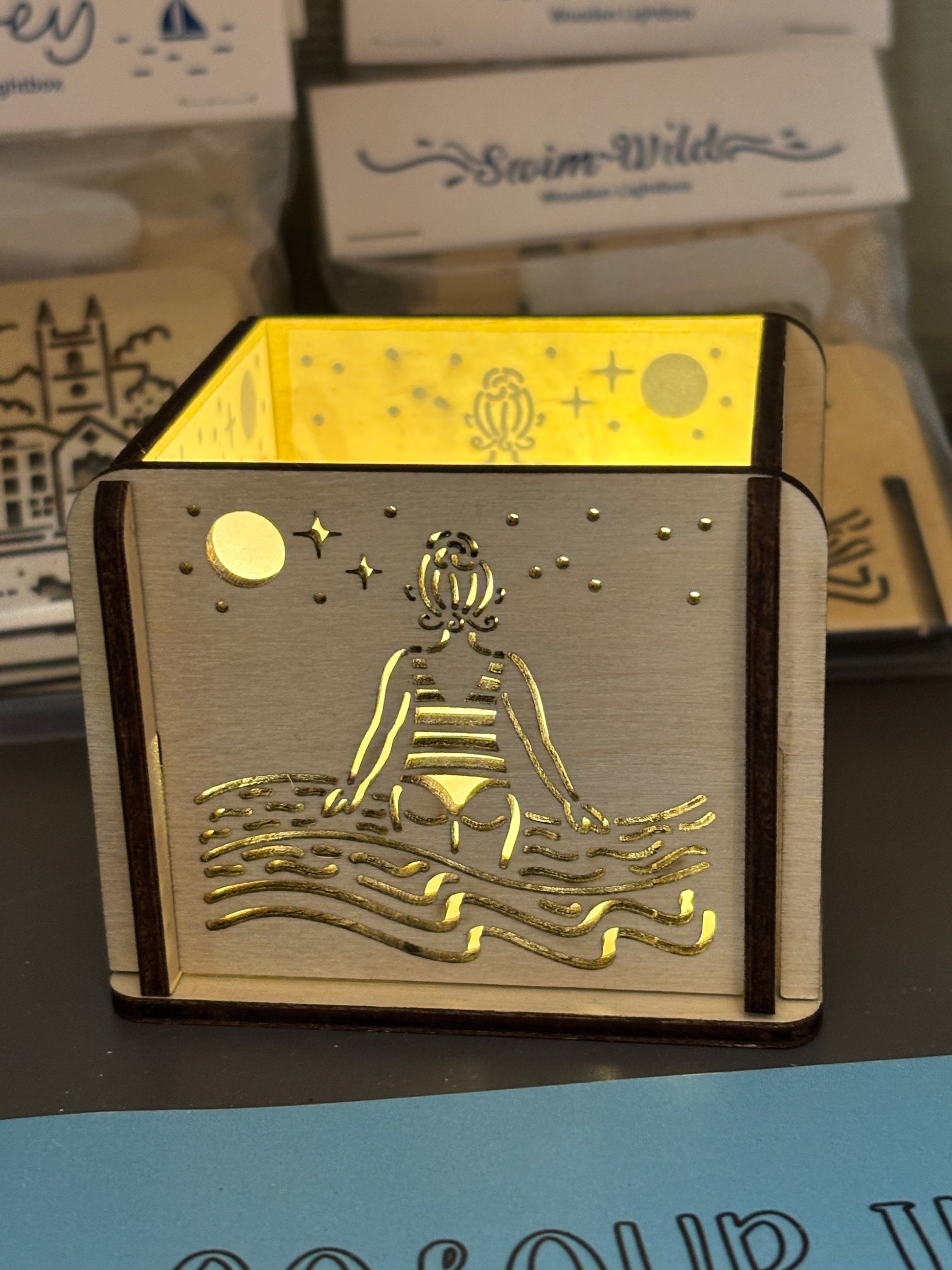 swim wild wooden lightbox—striped swimmer and moonlit sea design for cozy coastal decor and wild swim lovers
