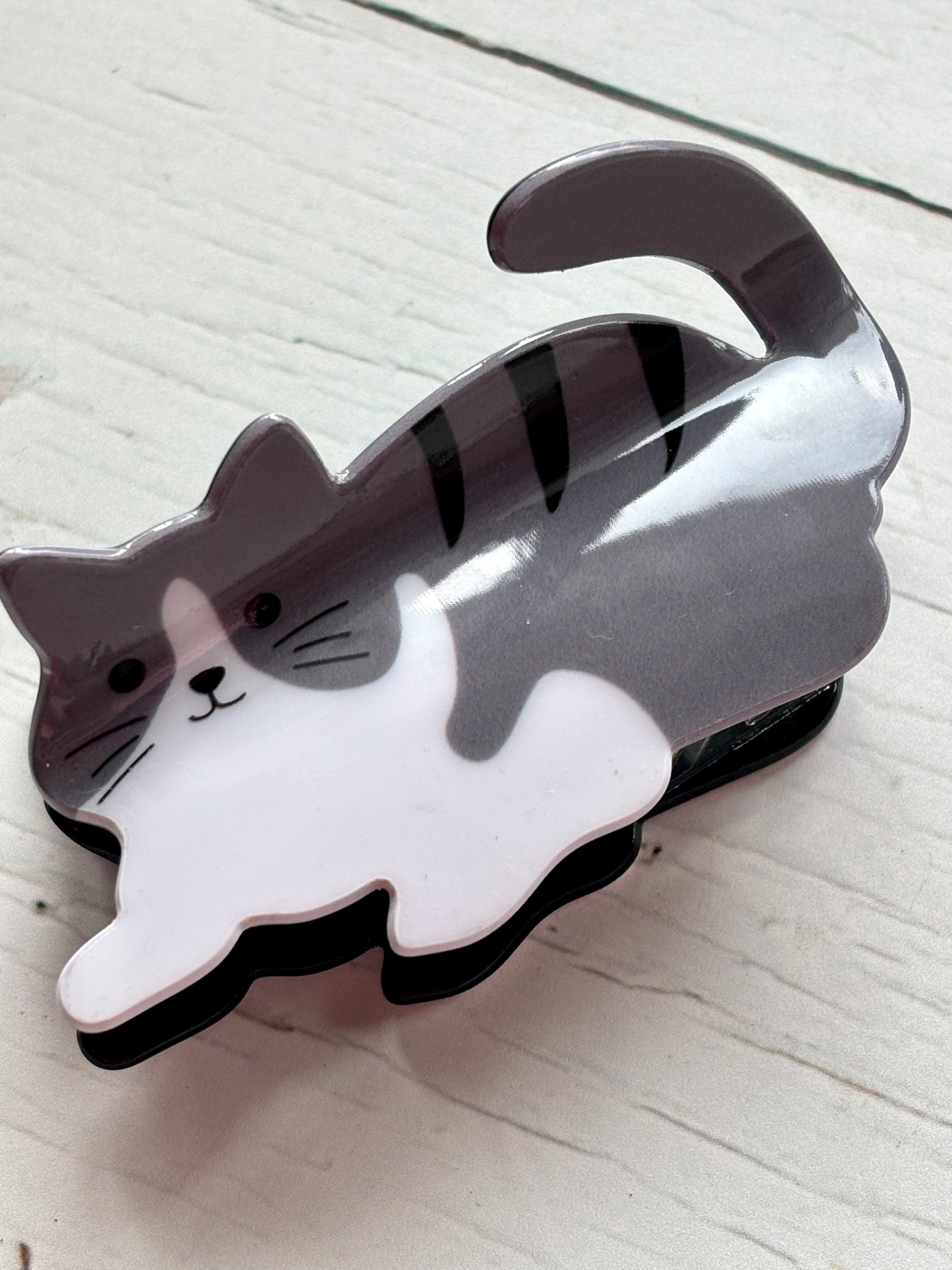 adorable grey and white tabby cat hair claw clip in a playful pose cute animal hair accessory, novelty cat lover gift