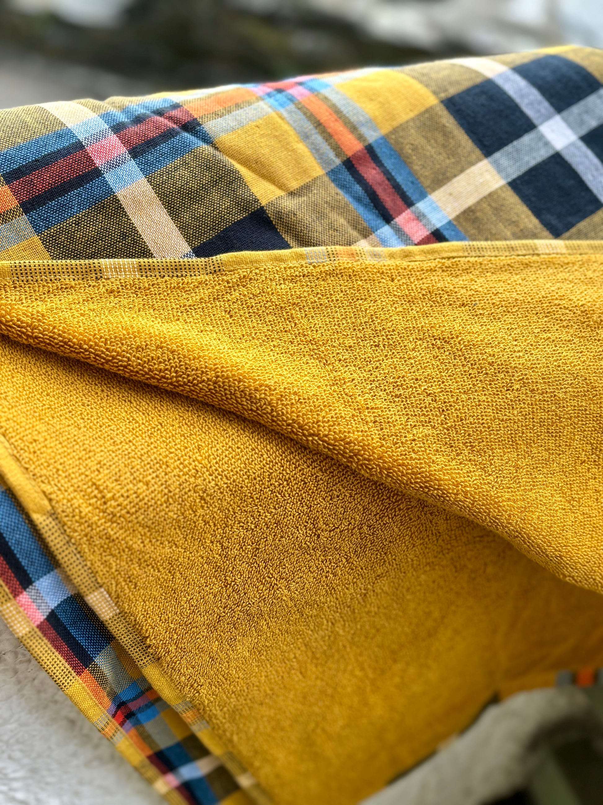 soft, plush reverse side of a yellow tartan cotton beach towel highly absorbent terry for quick-dry, luxury beach blanket