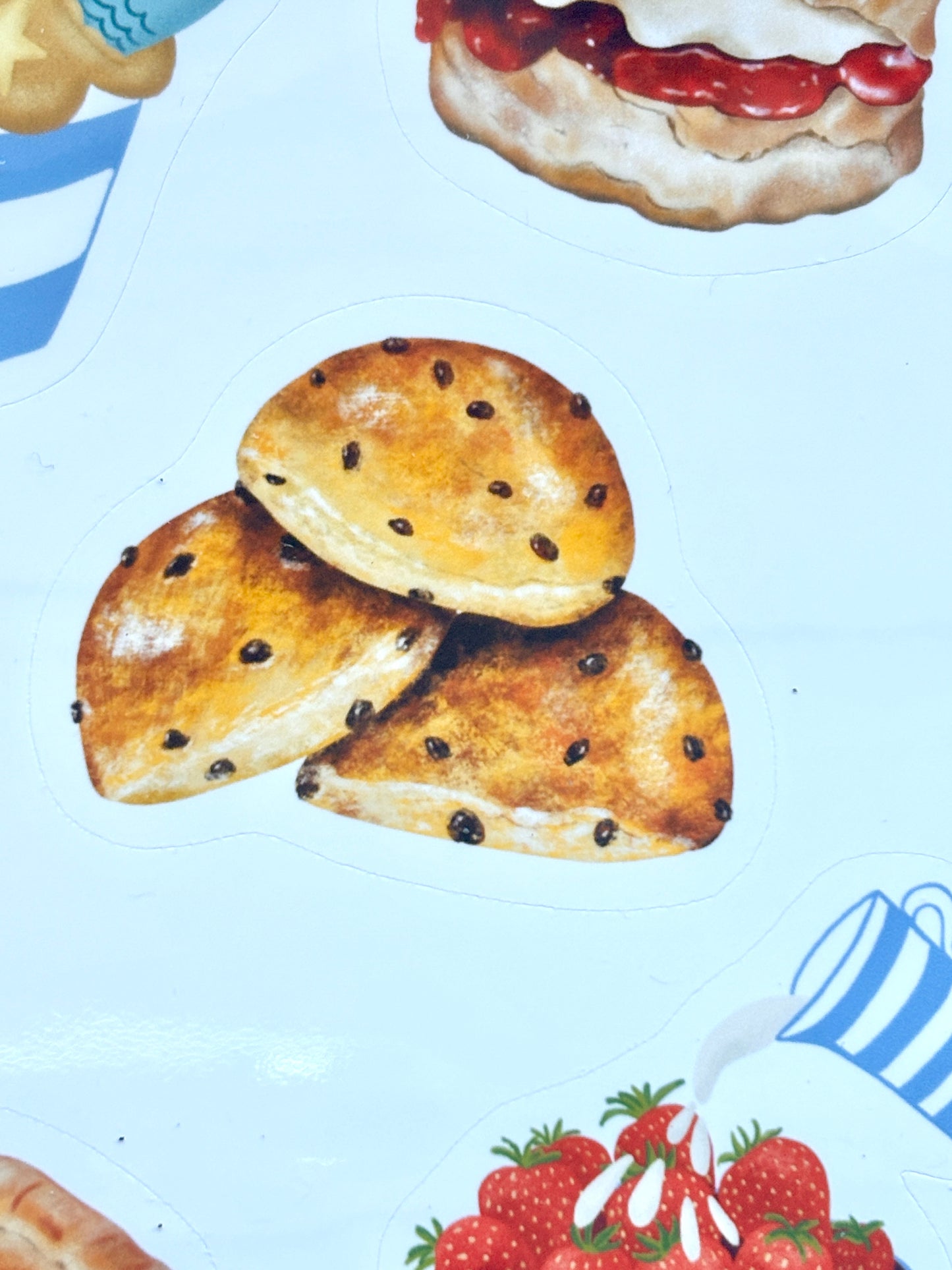 saffron bun sticker closeup, Cornish golden saffron cake with currants, traditional Cornwall bakery illustration