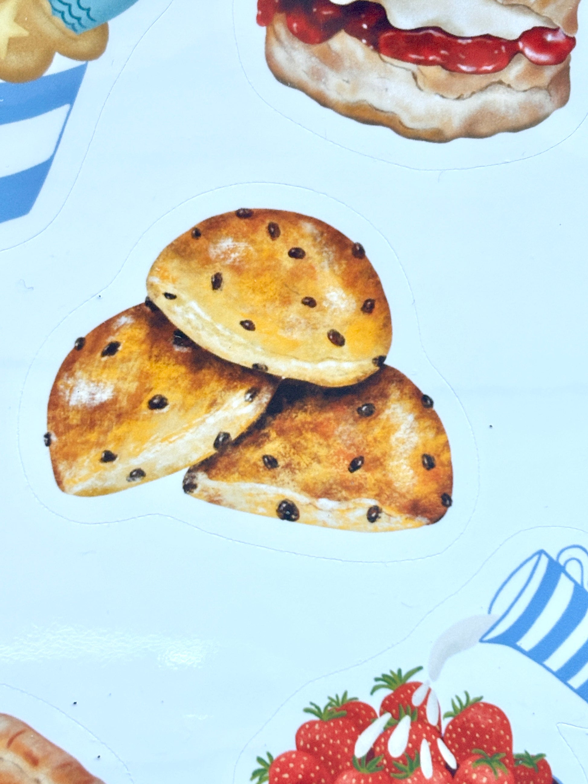 saffron bun sticker closeup, Cornish golden saffron cake with currants, traditional Cornwall bakery illustration