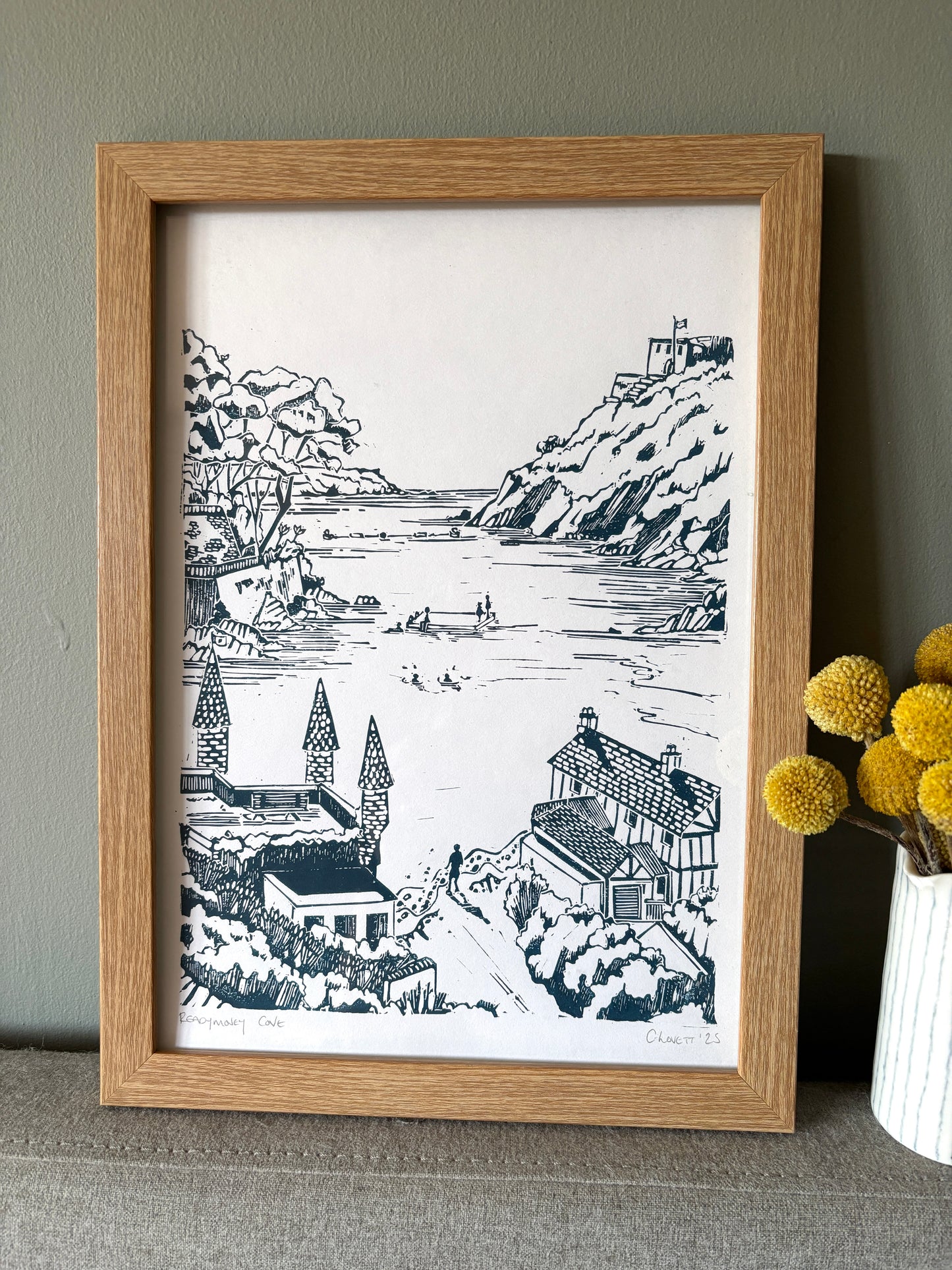 original print of a detailed coastal landscape linocut art showing a Cornish harbour, cliffs, and cottages unique wall art
