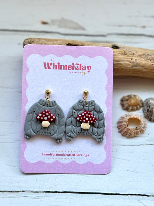 toadstool jumper earrings – handcrafted gnome-shaped ceramic studs with red mushroom caps, playful woodland-inspired design