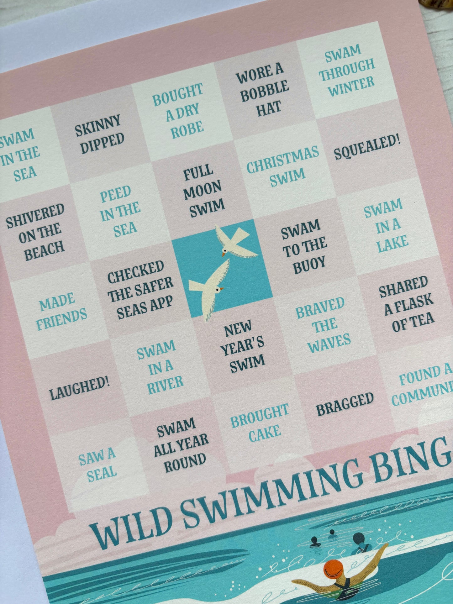 Wild Swimming Bingo game checklist. fatures challenges like 'New Year's Swim' and 'Shared a Flask of Tea' fun gift for water lovers