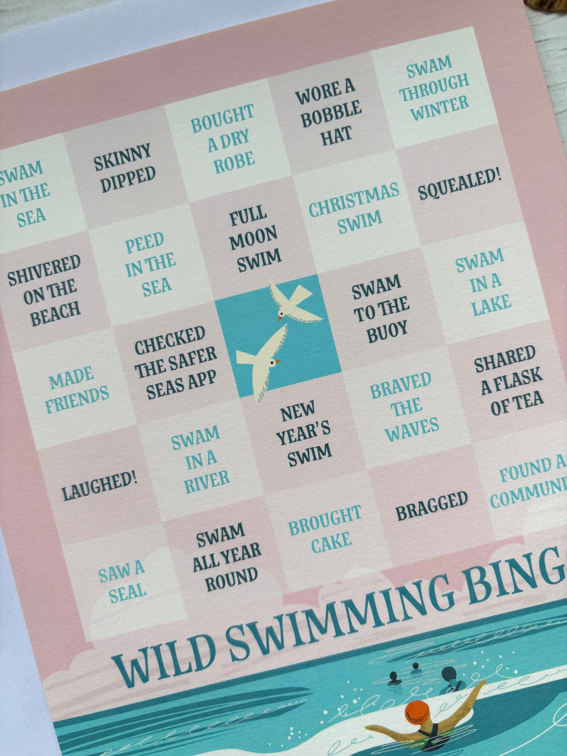 Wild Swimming Bingo game checklist. fatures challenges like 'New Year's Swim' and 'Shared a Flask of Tea' fun gift for water lovers