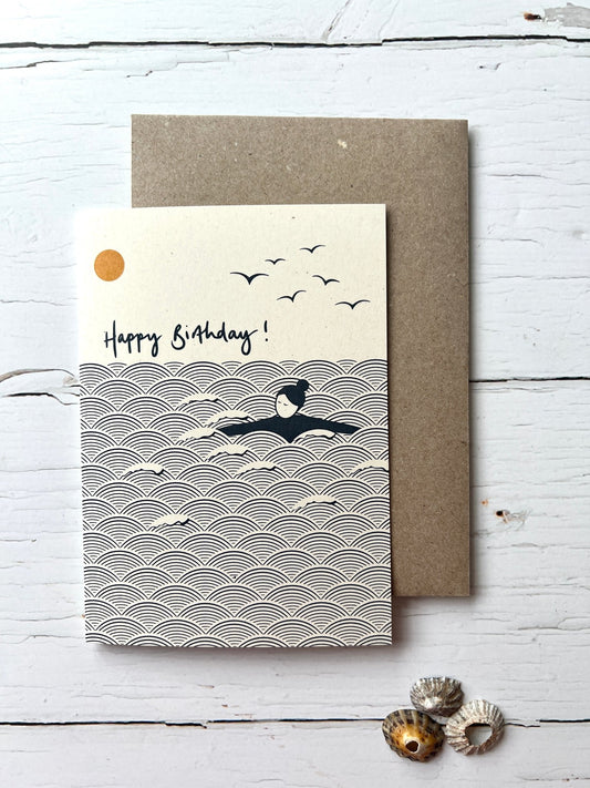 ocean-themed birthday card with swimmer, sun, and birds—minimalist coastal design for sea lovers
