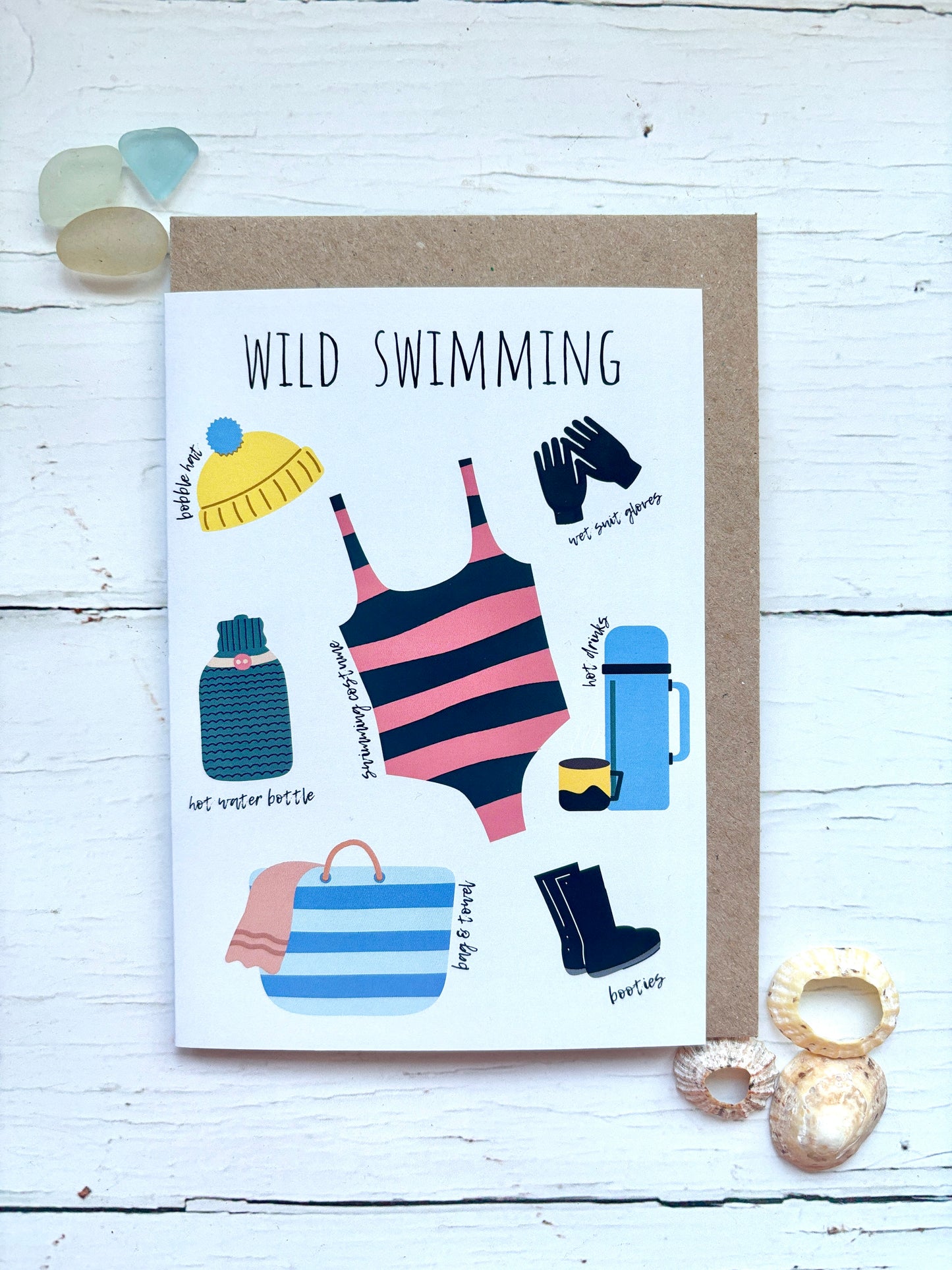 wild swimming greeting card featuring essential gear: swimsuit, bobble hat, gloves, thermos, beach bag, booties