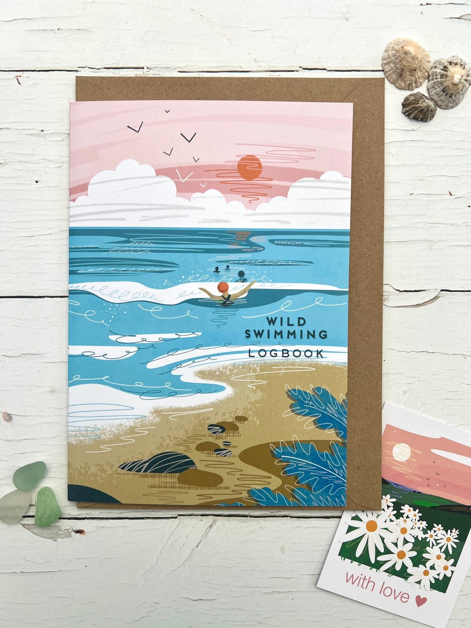 wild swimming logbook with illustrated coastal cover—track swims in this nature-inspired swim diary journal