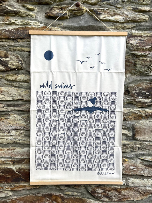 organic cotton tea towel with minimalist wild swimming illustration, ocean wave pattern and coastal design, eco-friendly kitchen textile