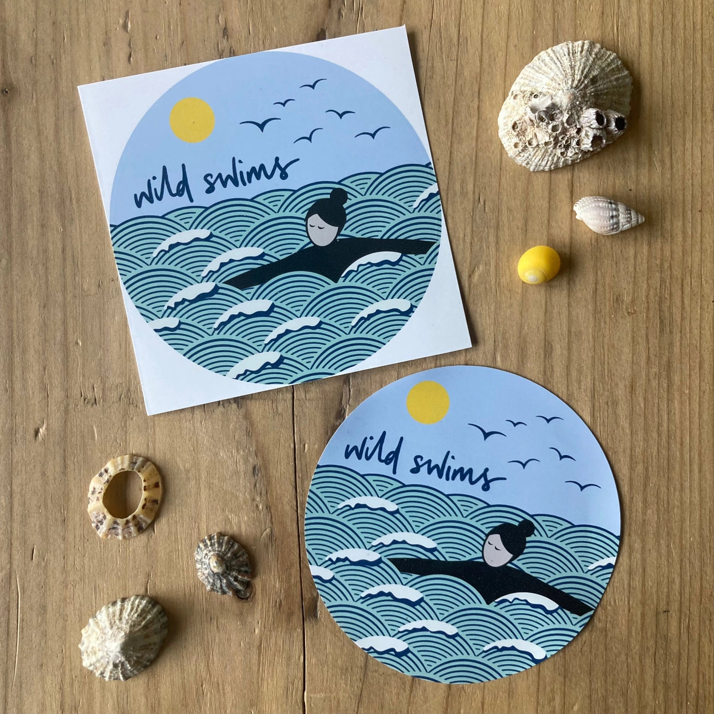 wild swims car window sticker featuring ocean waves, swimmer, sun, and birds—perfect for outdoor adventure lovers