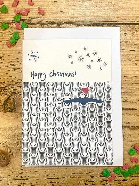 Happy Christmas swimmer card, minimalist winter ocean waves design with snowflakes, eco friendly festive holiday greeting card