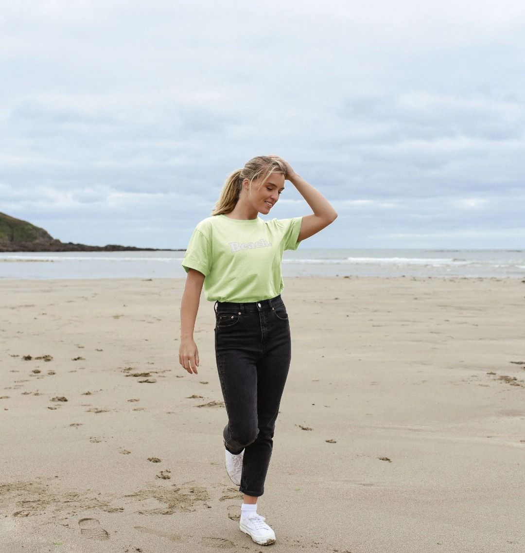 pastel green oversized women's beach t-shirt with relaxed fit and bold white "Beach" coastal print