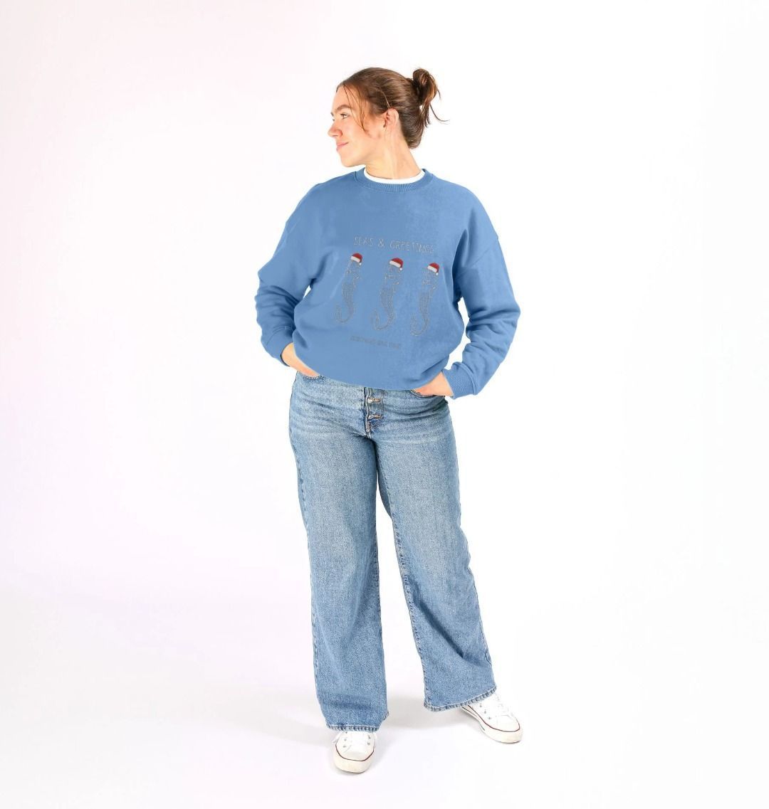 women's festive mermaid Christmas sweatshirt—“Seas & Greetings” oversized fit with Santa hats, ocean-themed holiday style