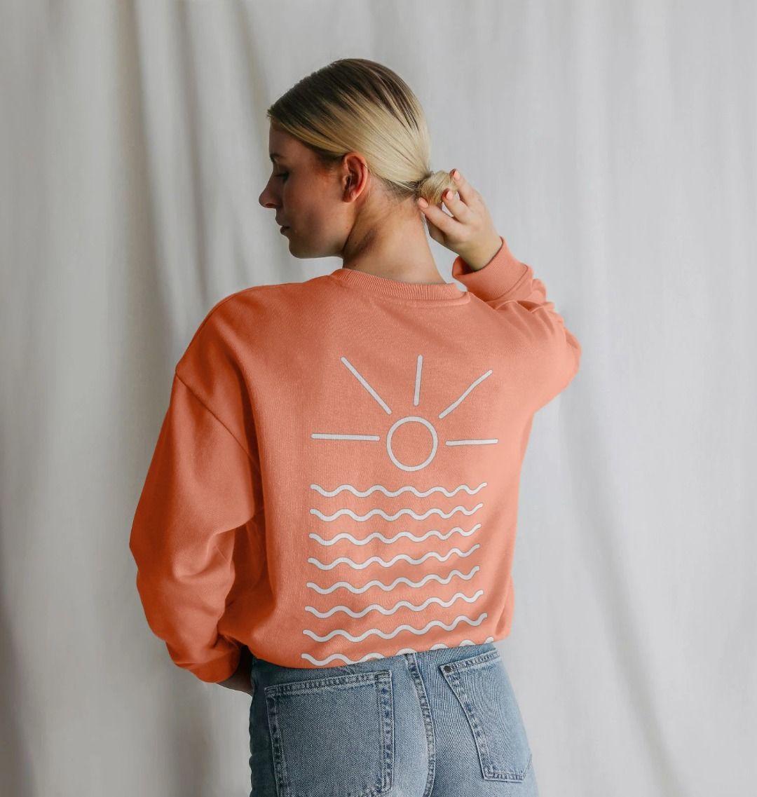 apricot oversized sweatshirt—sun-and-waves back print, relaxed Readymoney Cove coastal sunrise vibe