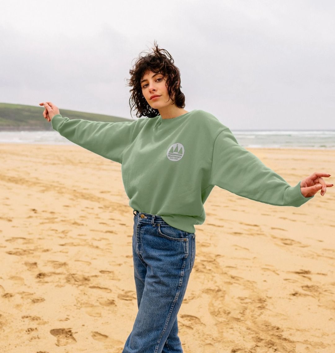women's sage oversized sweatshirt—“Adventure Awaits” chest logo, beach-ready coastal explorer style