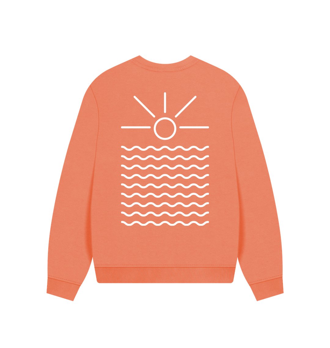 oversized apricot color sweatshirt—sunrise graphic over waves, coastal Readymoney Cove minimalist design