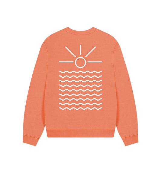 oversized apricot color sweatshirt—sunrise graphic over waves, coastal Readymoney Cove minimalist design