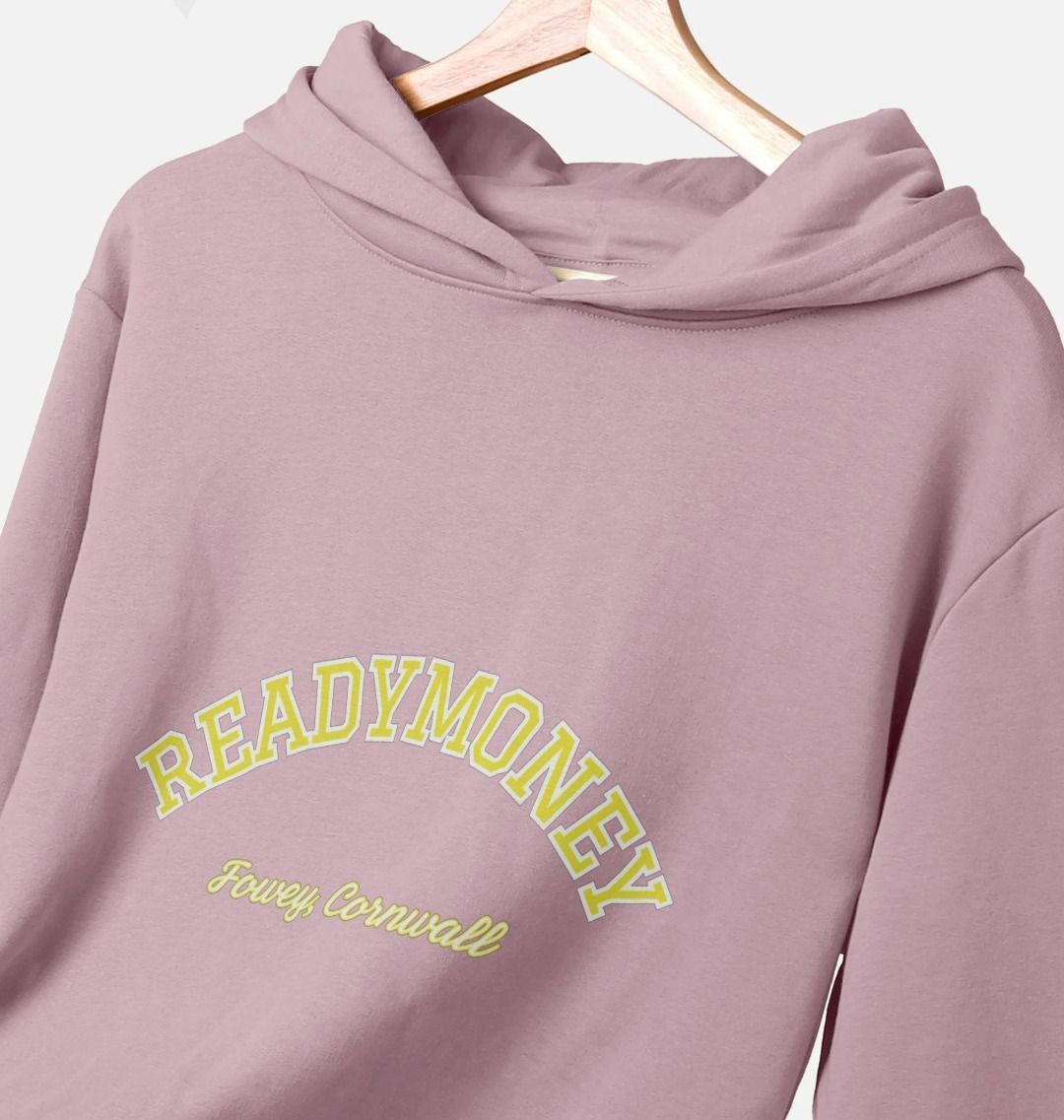 closeup shot of mauve women's relaxed-fit hoodie with varsity arch text, Readymoney Cove Fowey Cornwall print