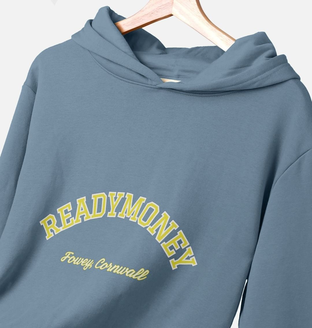 closeup shot of stone blue women's relaxed-fit hoodie with varsity arch text, Readymoney Cove Fowey Cornwall print