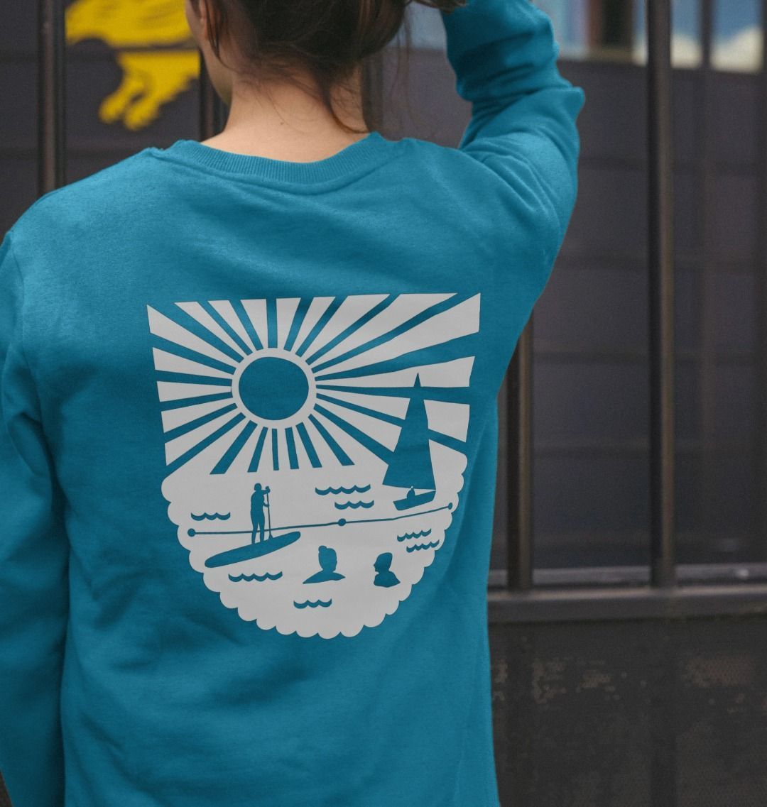 ocean blue oversized women's sweatshirt with bold white coastal graphic—relaxed fit for beach-inspired layering
