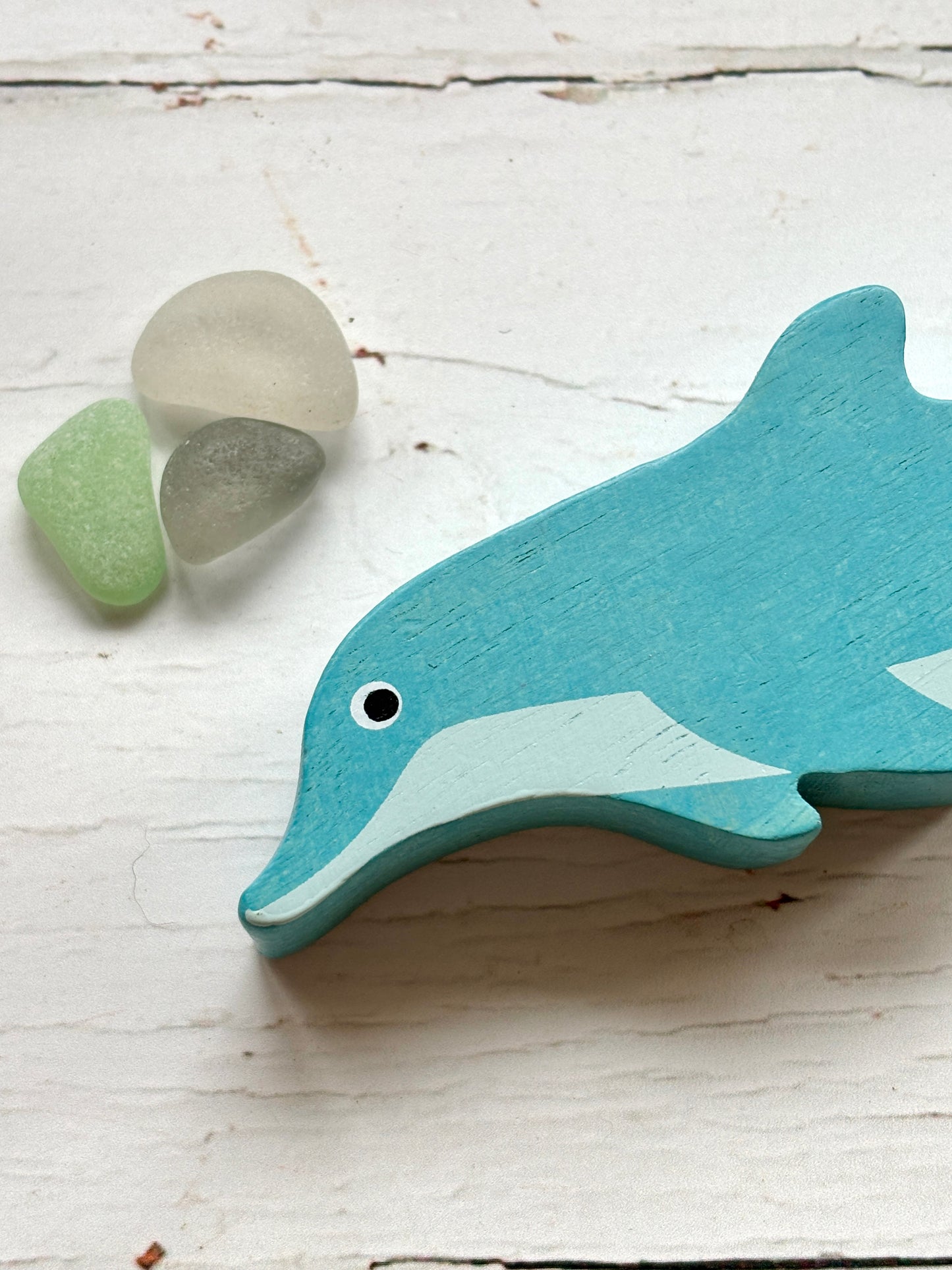 wooden dolphin toy head blue hand-painted sea animal for coastal nursery decor and sustainable kids' play