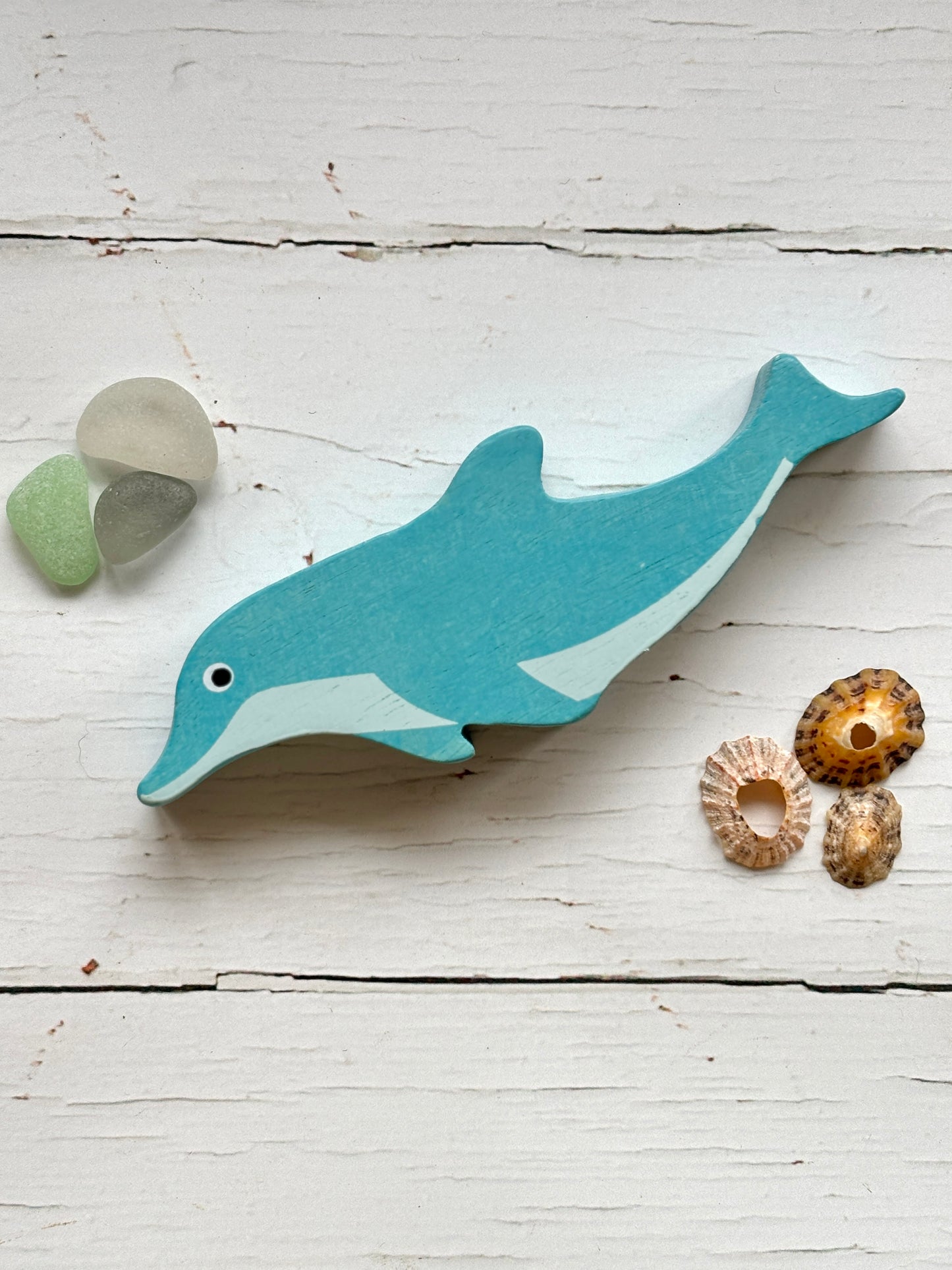 wooden dolphin toy blue hand-painted sea animal figurine for coastal nursery decor and sustainable kids' play