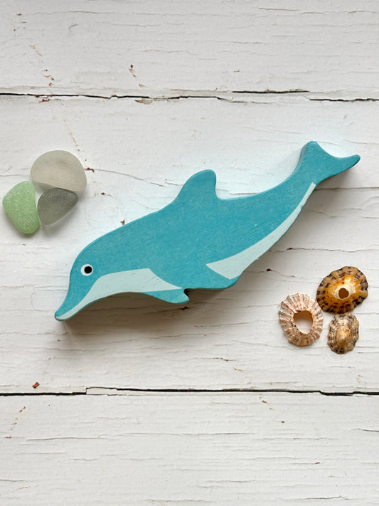 wooden dolphin toy blue hand-painted sea animal figurine for coastal nursery decor and sustainable kids' play