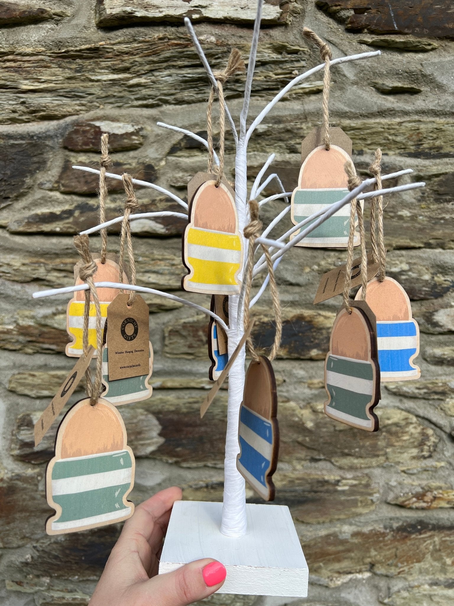 wooden easter egg tree display colorful hand-painted ornaments for festive spring home styling and holiday decor