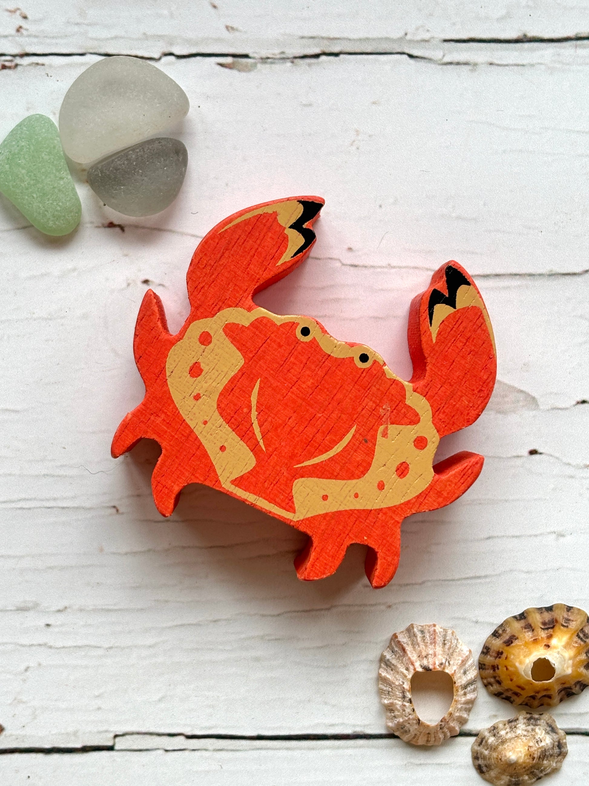 bright orange wooden crab toy with beach-themed design, coastal decor for ocean-inspired play and display
