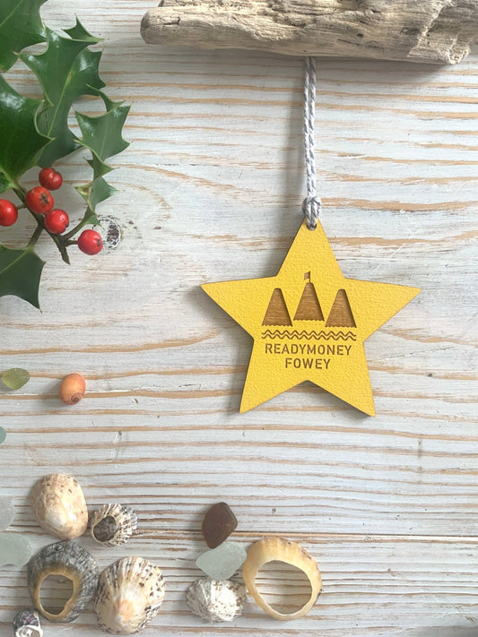 yellow wooden star ornament with “Readymoney Fowey” cut-out design, festive coastal decor with beach charm