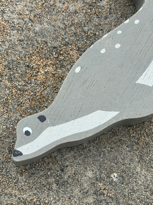 painted wooden seal toy with coastal charm, handcrafted marine animal decor for beach-themed play or display