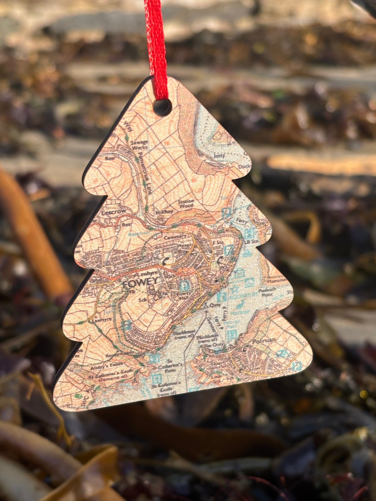 a wooden christmas tree shaped decoration featuring a map of Fowey