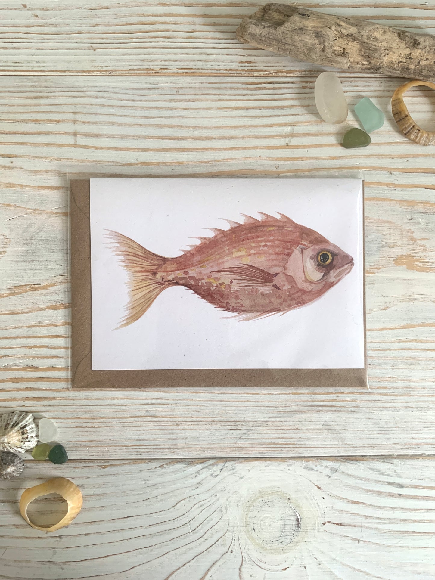 Card featuring watercolour of red sea bream