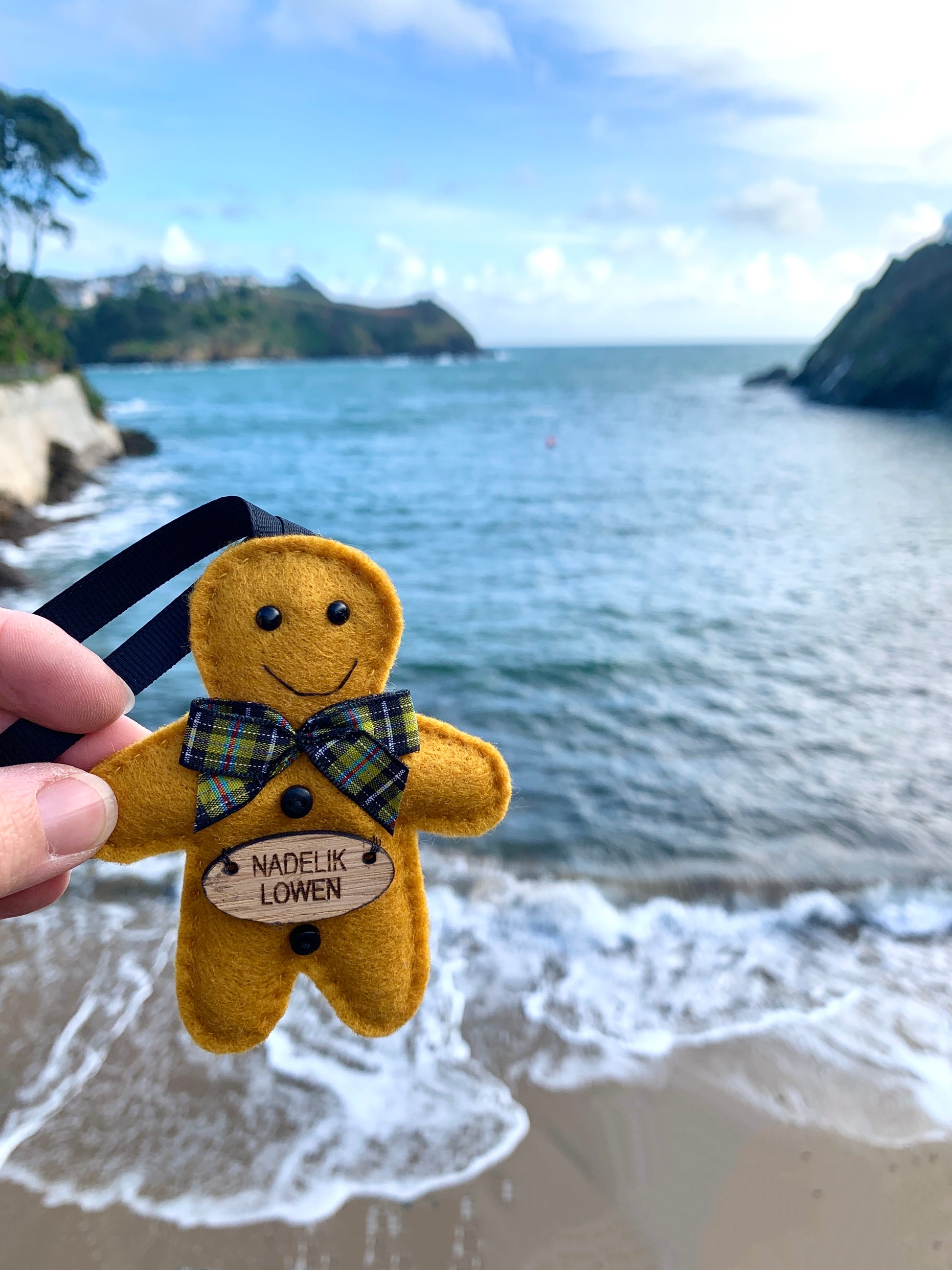 a felt Cornish gingerbread man at Readymoney Cove