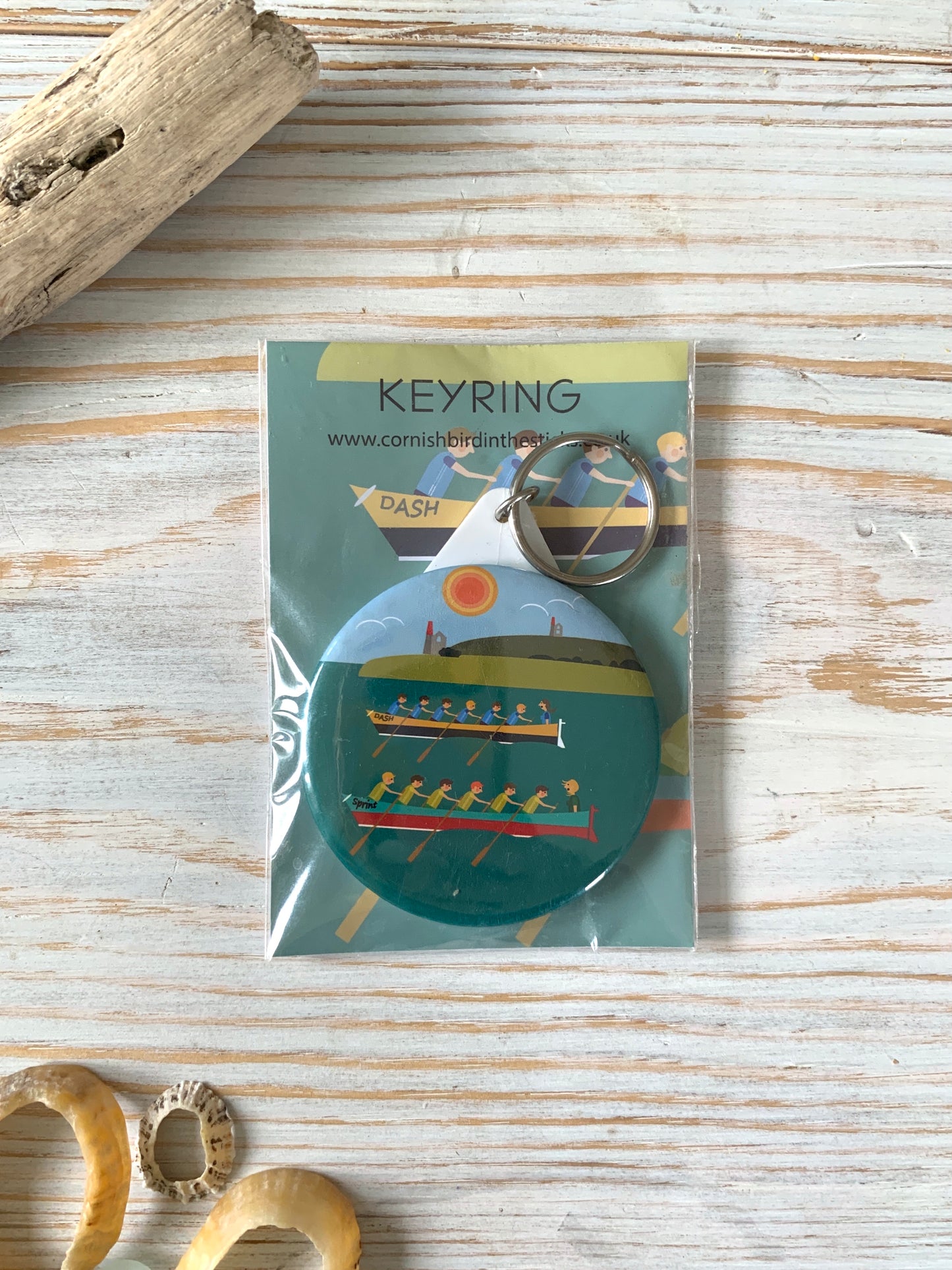 Colourful keyring depicting two gig boats racing