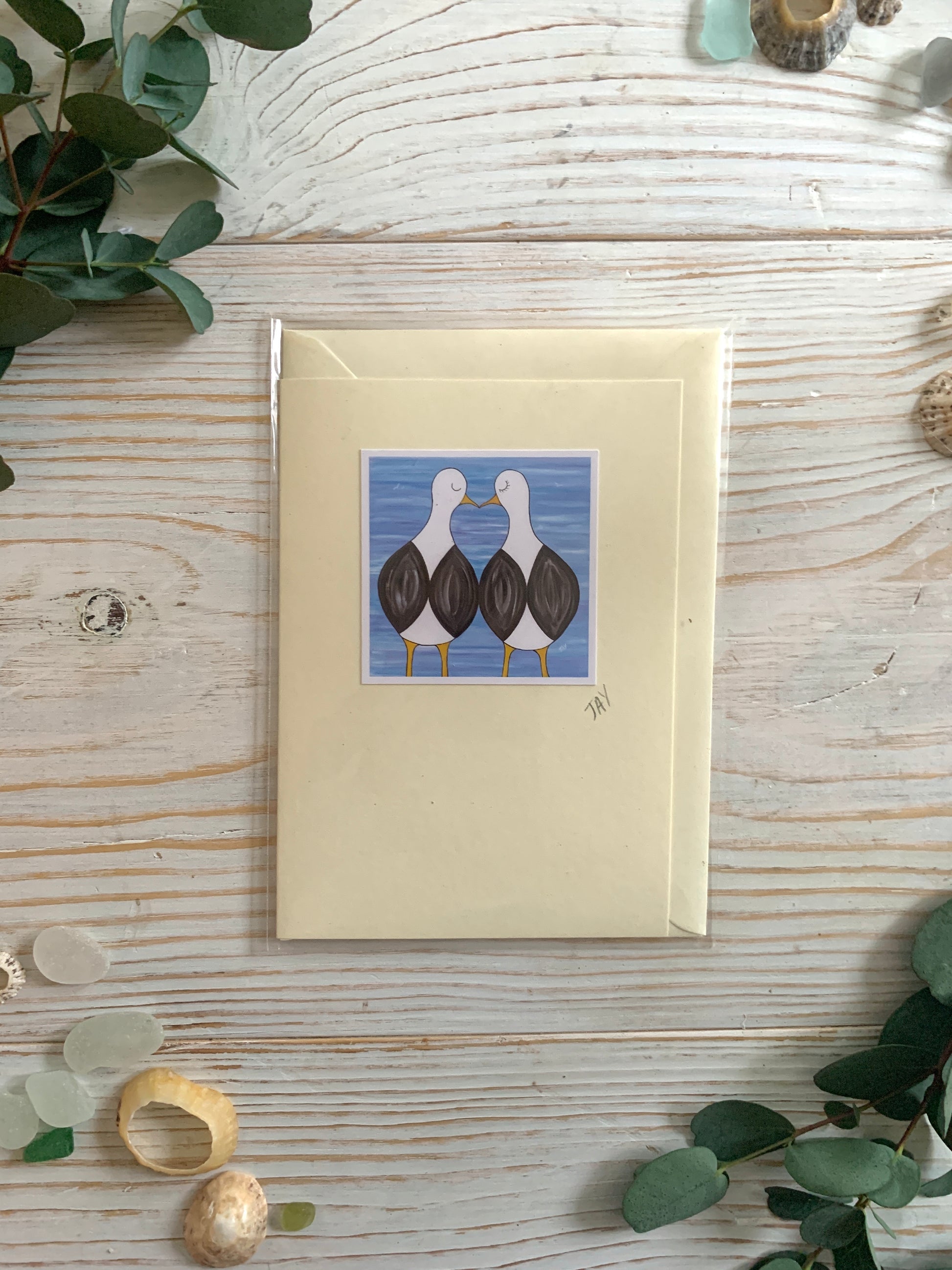 Greetings card with pair of kissing seagulls
