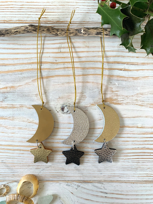 A handmade leather decoration featuring a moon and star