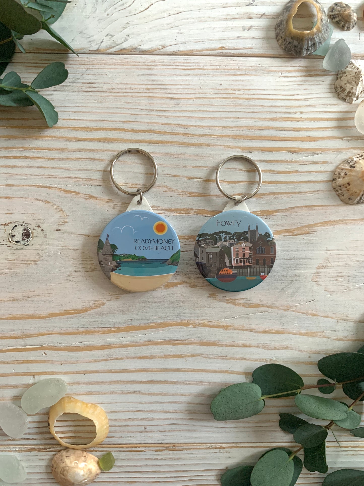 round keyrings featuring colourful digital images of Fowey 