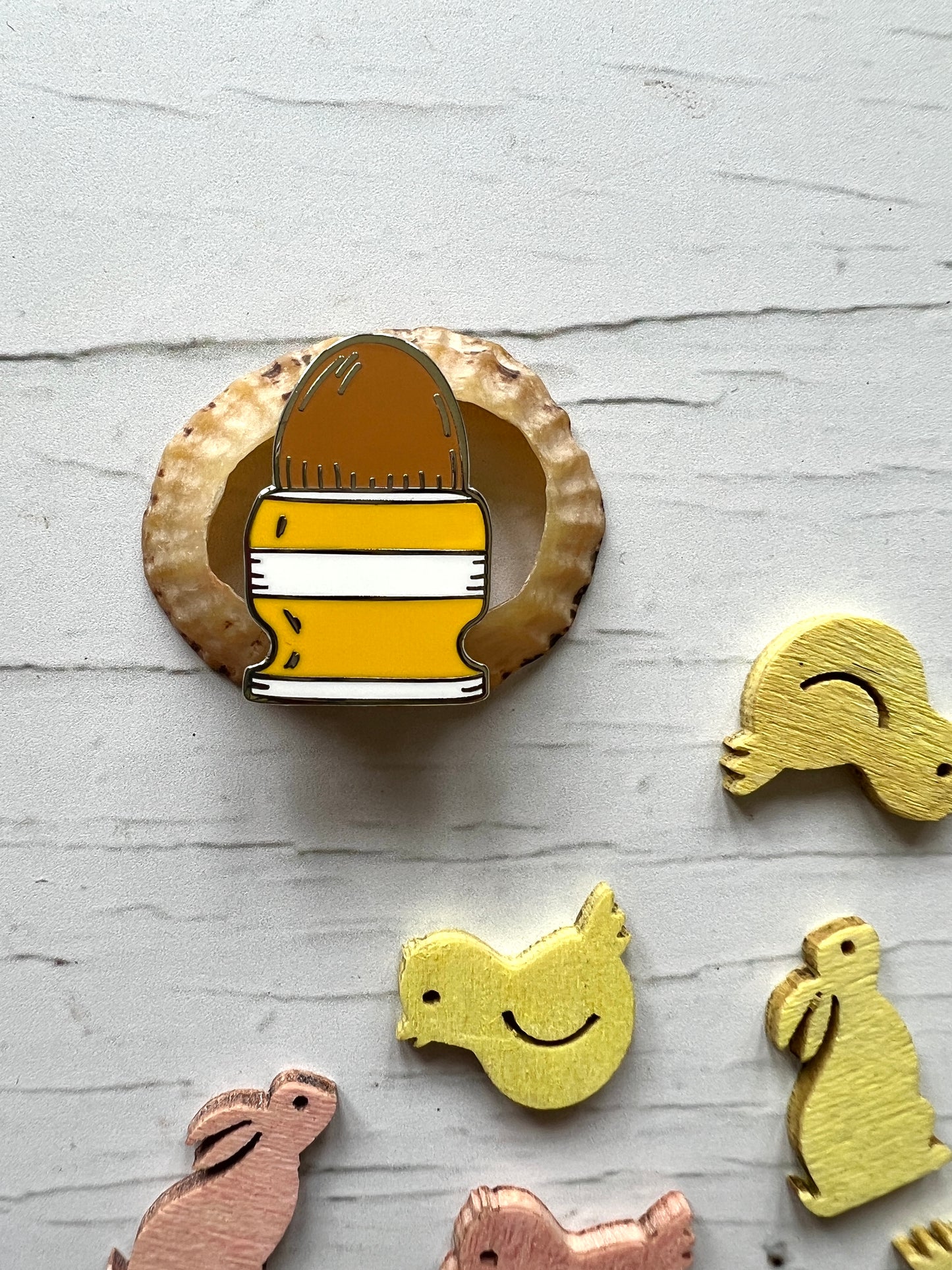 yellow striped egg cup enamel pin badge